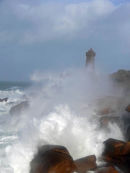 Lighthouse and wave